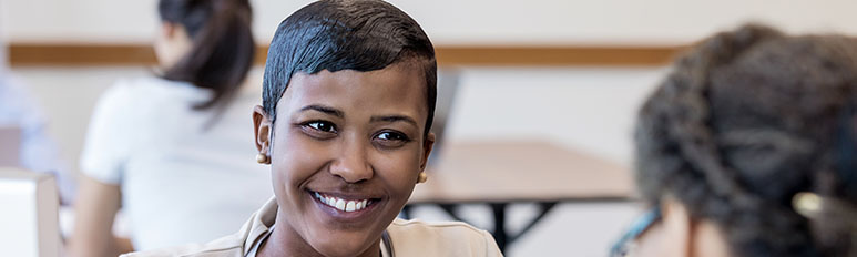 Cheerful mid adult bank employee
