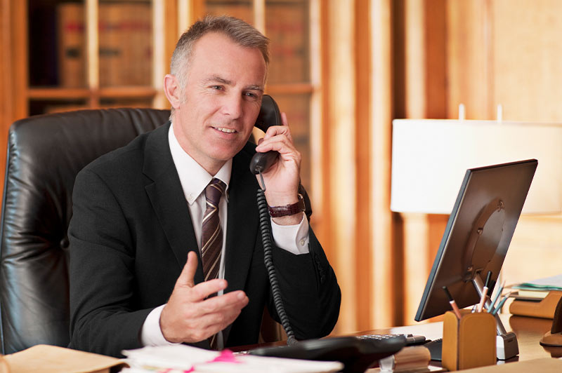 Lawyer speaking to client on phone