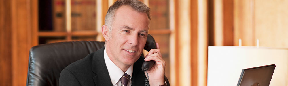Lawyer speaking to client on phone