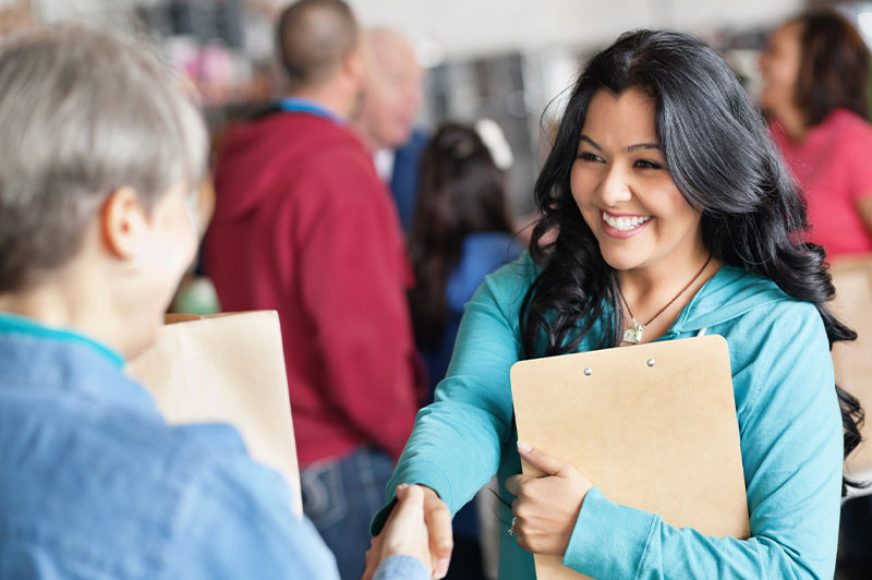 Non-profit organizer thanking a donor