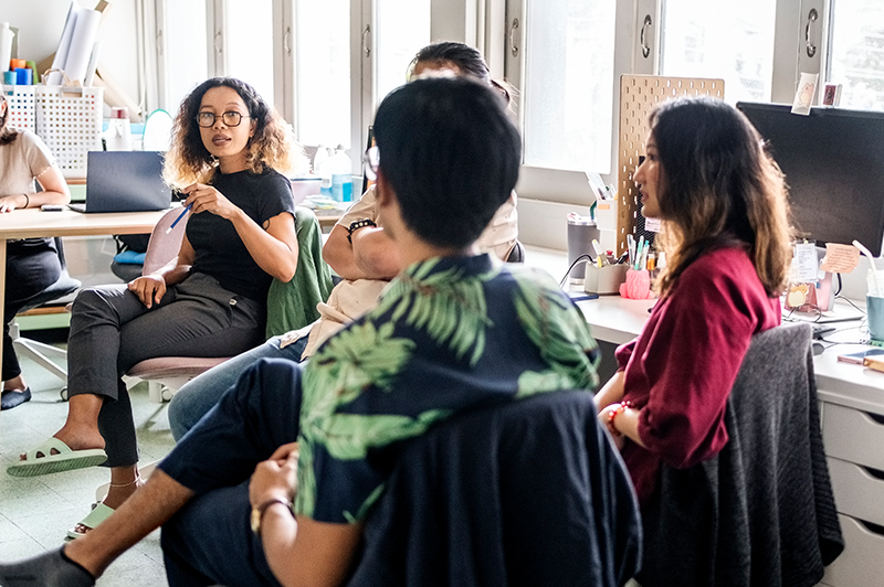 A group from a nonprofit meet in the office