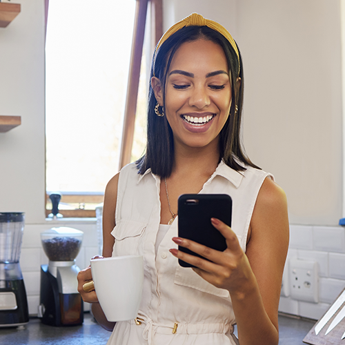Woman looking at phone and smiling