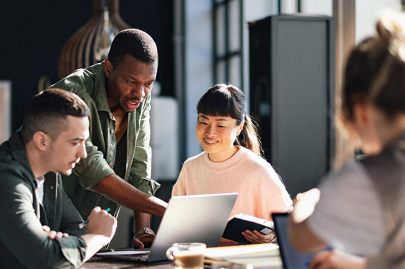 Diverse Team Working Together in Modern Co-Working Space